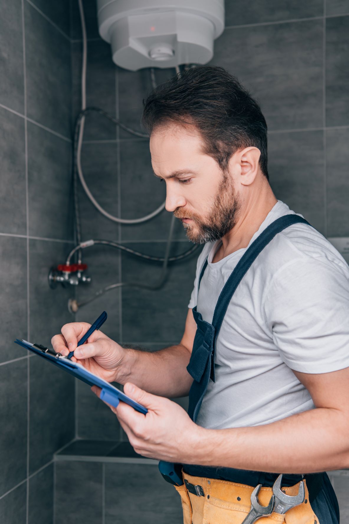 man checking certificate after a boiler installation