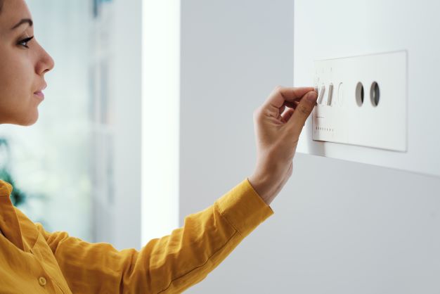 a woman concerned about what will replace gas boilers in 2025